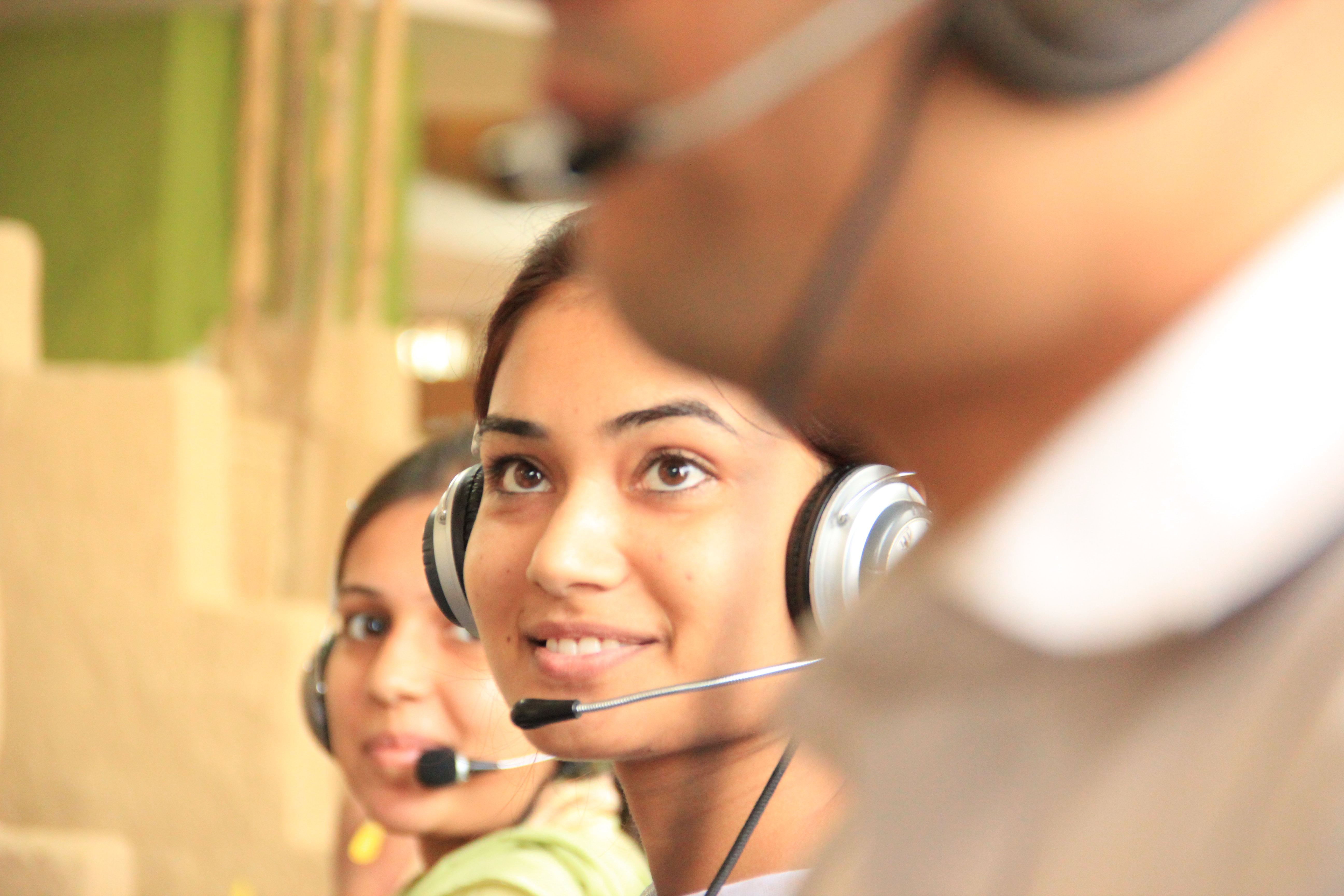 Agents wearing Contact Center Headsets